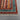 Corner close-up of hand-knotted striped wool Oriental rug