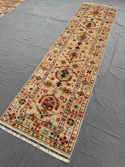 Full view of long Sultani hallway runner in beige & multicolor