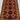 Close-up of hand-knotted wool weave in red and orange handmade tribal rug