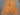 Top angle floor shot of wool tribal rug in orange, blue, and gold color scheme