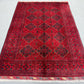 Top-down full view of Afghan tribal wool rug
