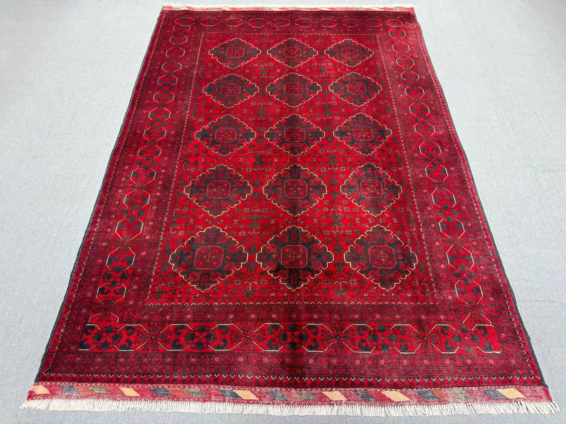 Top-down full view of Afghan tribal wool rug