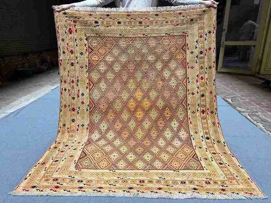Full top-down view of handwoven 5x6.2 Afghan Turkish rug with beige, gold & brown tribal geometric design