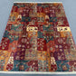 Traditional floor layout using a colorful kilim-style patchwork rug