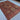 Traditional hand-knotted wool rug on hardwood floor