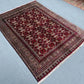 Traditional Turkish handmade rug laid out on modern floor