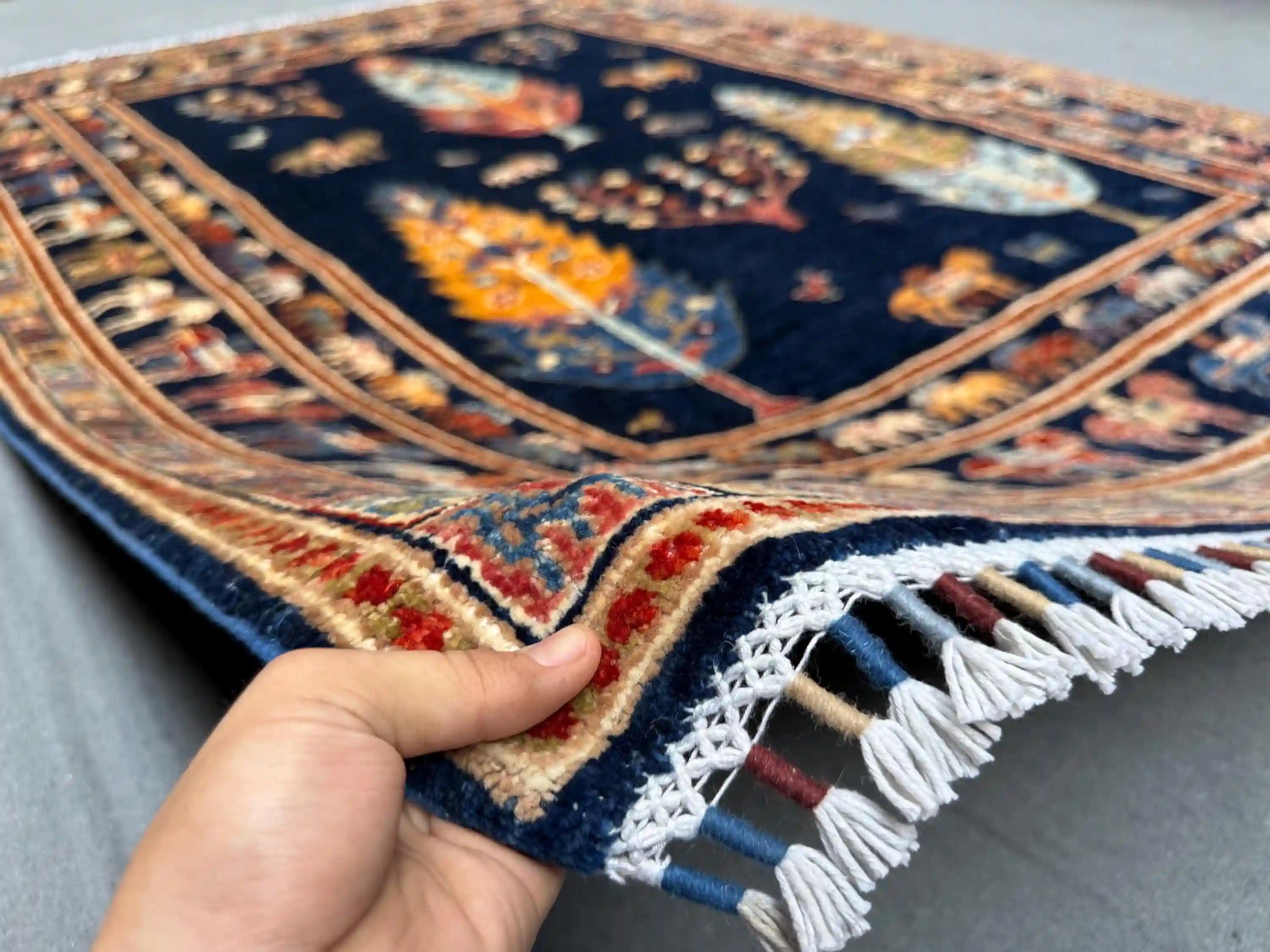 6x8 Tree of Life wool rug in hands, handmade dark blue carpet