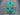 Full view of Tree of Life wool rug in turquoise blue on floor