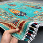 6x8 handmade Tree of Life wool rug in hands, turquoise blue