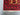 Detailed view of corner and border of red Persian rug