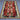 Top view of star medallion flatweave rug on wooden floor.