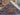 Folded view showing tribal motifs of hand-knotted Heriz rug