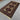 Turkish geometric carpet on wooden floor background