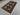 Turkish geometric carpet on wooden floor background