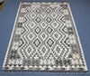 Floor view of tribal patterned wool Kilim rug in monochrome colors