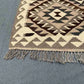 Corner weave close-up of tribal Turkish Kilim rug – handmade wool flatweave with knotted texture.