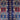 Close-up of bold tribal pattern on blue and red handmade Oriental rug