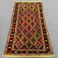 Floor view of tribal Afghan kilim runner rug placed in narrow space