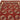 Close-up of the hand-knotted weave pattern on red tribal wool rug