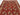 Close-up of the hand-knotted weave pattern on red tribal wool rug
