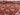 Folded handmade Turkman tribal wool rug showing backside