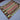  Diagonal top view of wool Turkish Kilim rug on hardwood floor – ethnic decor