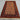 Handmade beige and red Turkish rug styled on wooden floor