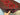  Handmade Turkish rug in hand – red and black wool knotted carpet with tribal motifs