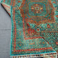 Folded vibrant Mamluk carpet showing fine wool weave and rich tones