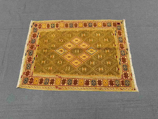 Vintage flatweave wool kilim rug styled on modern home floor