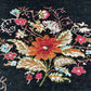 Close-up of vintage floral design on black handmade Karabakh rug