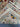 Folded wool rug highlighting the detailed floral pattern and handwork