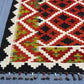 Corner detail of 5x7 handmade red kilim rug – vintage geometric design
