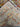 Folded view of vintage Afghan runner highlighting geometric design