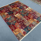 Room view of vintage wool patchwork rug with colorful Persian elements