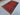 Vintage tribal wool rug laid out flat on floor