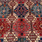 Close-up of tribal motifs on handmade 5x7 Waziri wool rug