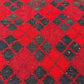 Close-up texture of wool flatweave on small red Afghan Kilim – authentic handwoven finish.