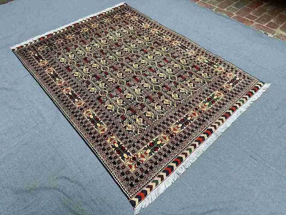 Wool silk handmade floral rug styled in modern bedroom setup