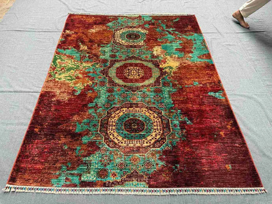 Modern wool and silk rug displayed on hardwood floor