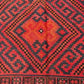 Close-up view of wool texture on Turkish Kilim rug – hand-knotted red and black flatweave.