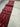 Close-up of wool knotted weave in extra-long red Persian-style hallway rug