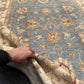 Handmade Afghan Ziegler Chobi Rug 5x7 ft shown in hands for scale
