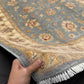 Person holding Authentic Ziegler Chobi Rug 5x7 ft – Blue Afghan wool carpet