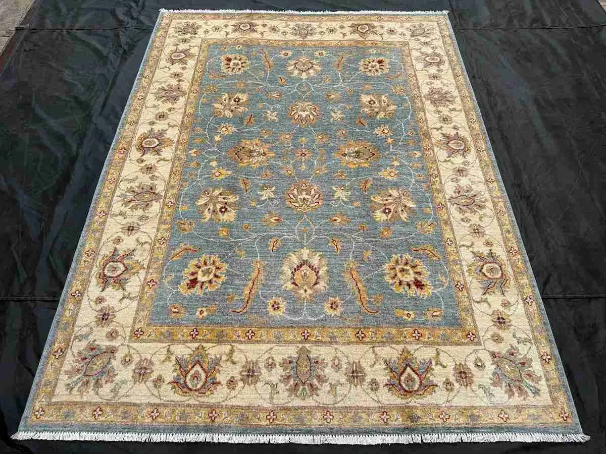 Top-down view of Afghan blue Ziegler Chobi rug 5x7 f
