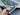 Handmade Ziegler rug in teal and gray – wool silk Persian carpet held in hands