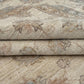 Folded handmade wool Ziegler carpet showing weave detail